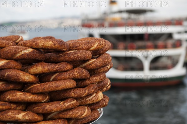 Typical Turkish Street Food, Simit for sale on the Galata Bridge in Istanbul, Turkey