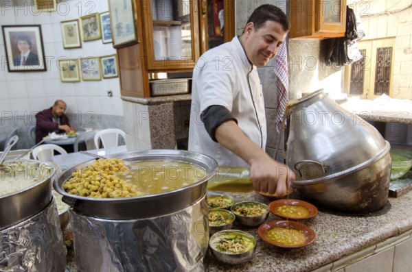 Amman, Jordan. December 12th 2012 Hashem Restaurant, downtown Amman, Jordan. Fuul, Falafel and Hummus being prepared at the legendary eatery