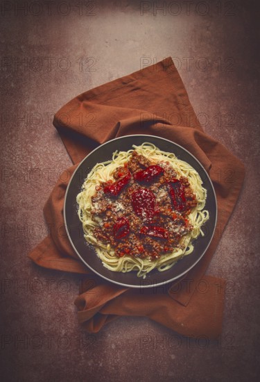 Spaghetti bolognese, with dried tomatoes, homemade, close-up