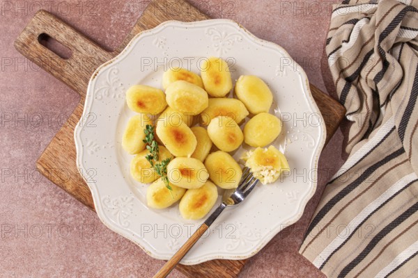 Stuffed gnocchi with cheese, Italian dumplings, garnished with parmesan cheese, no people