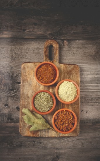 Georgian spices, in ceramic bowls, assortment, set of spices, utsho, adjika, Svan salt, ground coriander, top view, no people