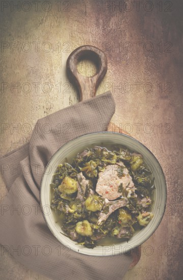 Chakapuli, Georgian dish, stewed meat with herbs and tkemali, in white wine, homemade, no people