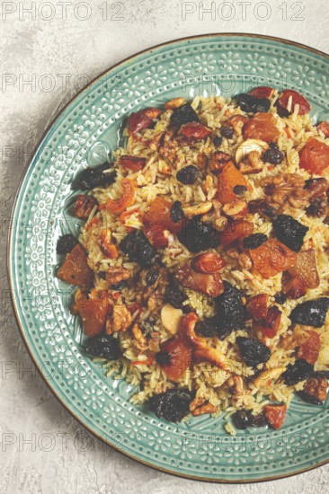 Rice dish, with the addition of dried fruits, nuts and spices of Middle Eastern cuisine, homemade, no people