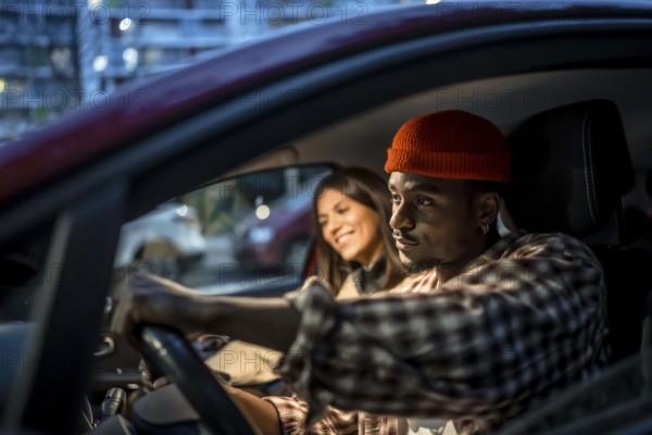 Young couple driving through city streets at night, enjoying a relaxed evening outing together laughter, conversation and shared adventure during an urban weekend drive