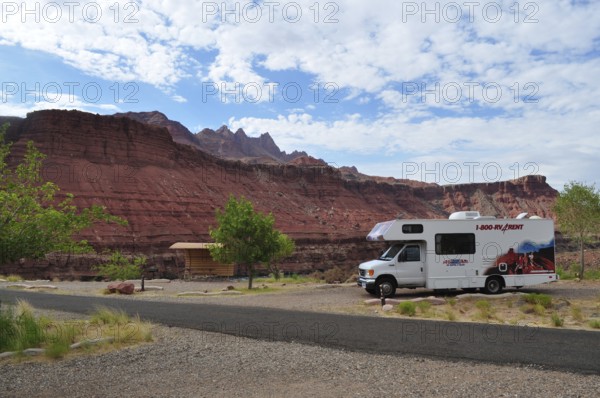 Motorhome standing in a rocky landscape with red rocks and partly cloudy sky, Grand Canyon National Park, Arizona, USA