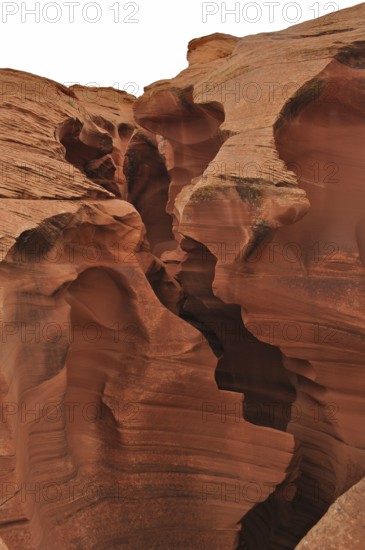 Massive sandstone structures with dramatic fissures, entrance to Antelope Canyon, Navajo Nation Reservation, Lake Powell Tribal Park, Arizona, USA