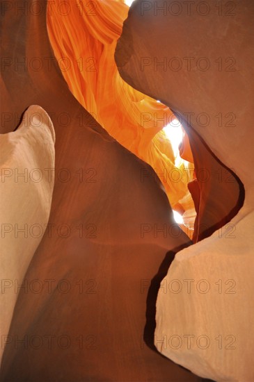 Spectacular rays of light penetrate organic orange sandstone formations, Antelope Canyon, Navajo Nation Reservation, Lake Powell Tribal Park, Arizona, USA