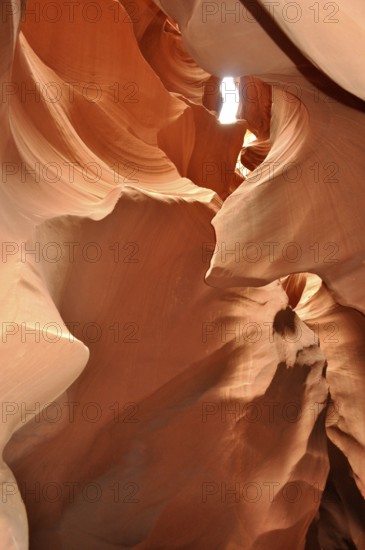 Light transmission through narrow openings in the curved sandstone canyons of a sandstone canyon, Antelope Canyon, Navajo Nation Reservation, Lake Powell Tribal Park, Arizona, USA