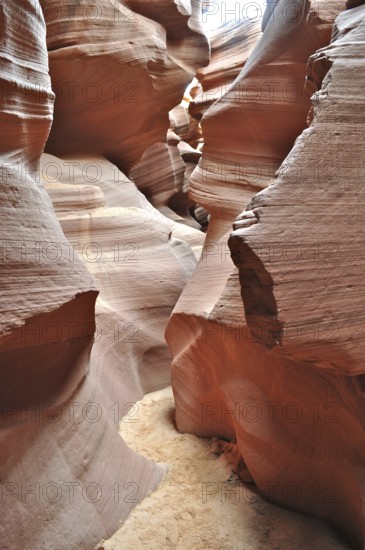 Earthy layers in a sandstone canyon that have formed narrow paths due to erosion, Antelope Canyon, Navajo Nation Reservation, Lake Powell Tribal Park, Arizona, USA