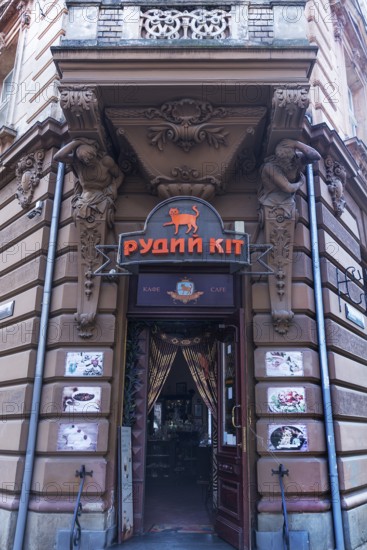 Entrance with atlases, 19th century tenement house, today Café, Lemberg, Ukraine