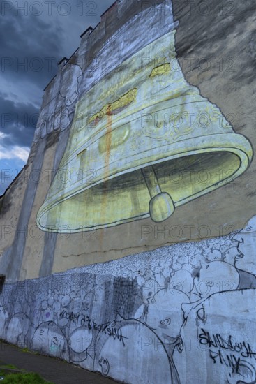 Wall painting of a bell on a house wall, Krakow, Poland