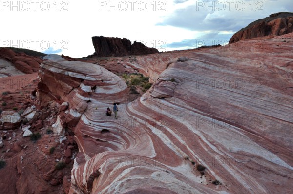 Striped rocks in the desert during dramatic cloud play, Valley of Fire State Park, Nevada, USA