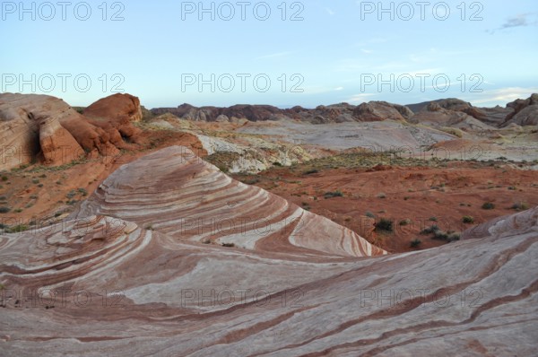 Rock formations with distinctive red and white stripes under a blue sky, Valley of Fire State Park, Nevada, USA