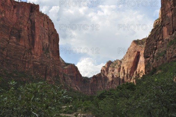 Dramatic rock formations in the red canyon under a cloudy sky, Zion National Park, Utah, USA