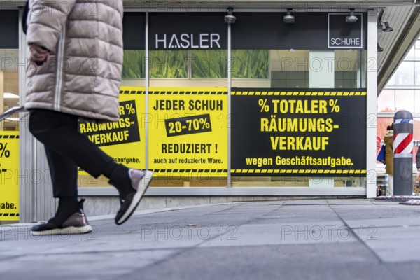 Clearance sale in the city center. A shoe store offers discounts on sales. Stuttgart, Baden-Württemberg, Germany