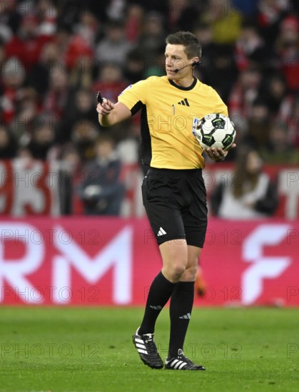Referee Daniel Siebert with match ball gesture soccer Bundesliga, DFB-Pokal, Allianz Arena, Munich, Bayern, Germany
