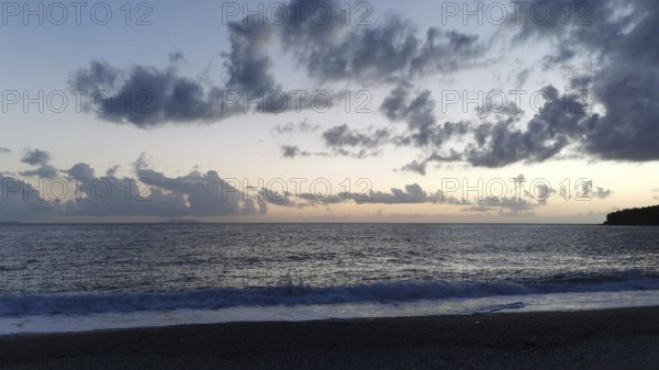 Tranquil seascape at sunset with cloudy sky, Himare, Albanian Riviera