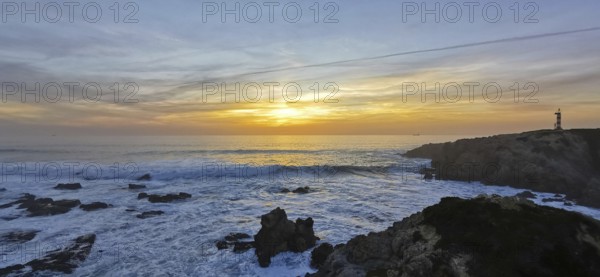 A lighthouse watches over the turbulent sea at sunset, the waves hit the rocks, hike the Fisherman's Trail, hike the Fisherman's Trail, Southwest Alentejo nature park Park and Vicentina Coast, Portugal, Portugal