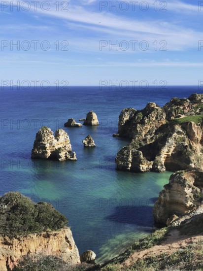 Spectacular seascape with unique rock formations in clear water, Lagos, Algarve, Portugal