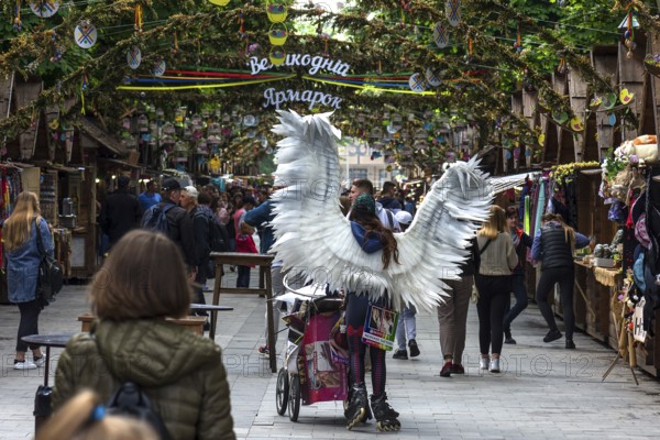Promotional campaign with an angel costume on Svoboda Prospekt, Lviv, Ukraine
