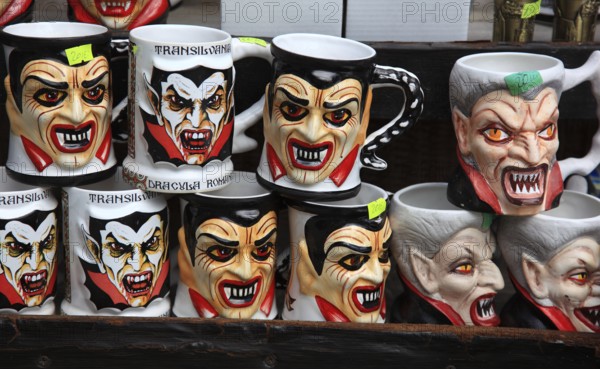 Souvenir sale at Bran Castle, marketing of Dracula, printed here on cups, Törzburg, in Transylvania, Romania. It is famous as Dracula's Castle and one of the country's main attractions