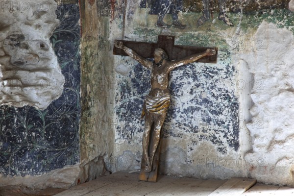 Interior frescoes and crucifix of the chapel in the fortified church of Honigberg, Harman, Burzenland in Transylvania, Romania