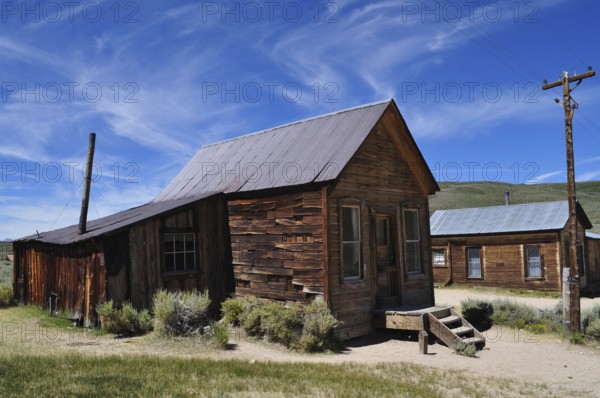 Rustic wooden house under a clear sky in an abandoned town, Bodie Ghost Town, California, USA