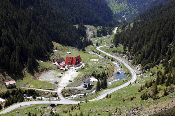 Landscape on the Transfogarasan Highway, Transfagarasan, connects the Arges Valley in Great Wallachia with the Olt Valley in Transylvania, crossing the Fagaras Mountains in the Transylvania Alps, to melt snow in May, Romania