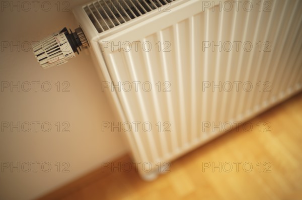 Interior view, thermostat, controller, valve, radiator valve, radiator, heat, parquet, building services, energy costs, Stuttgart, Baden-Württemberg, Germany
