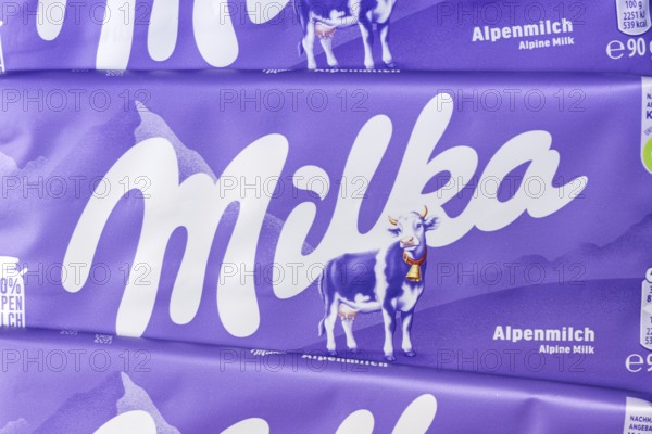 Milka chocolate 90g bar chocolate bar alpine milk chocolate background with logo in Stuttgart, Germany