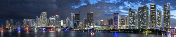 Miami skyline with high-rise real estate in downtown ocean panorama at night in Miami, USA