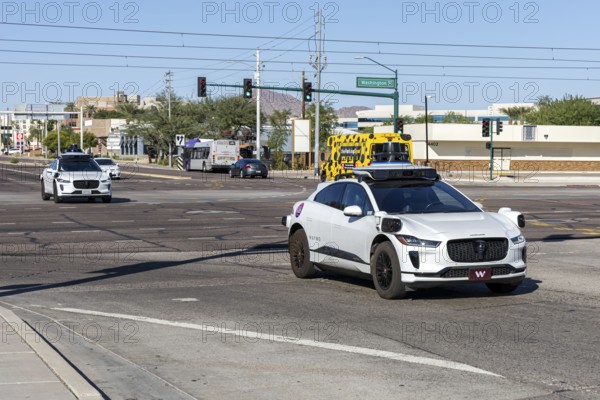 Waymo self-driving autonomous vehicles driverless cars from Google and Jaguar Robotaxi in Phoenix, USA