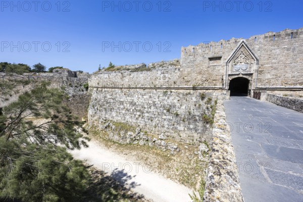 Red gate from the Middle Ages in the city wall of the historic old town on the island of Rhodes, Greece