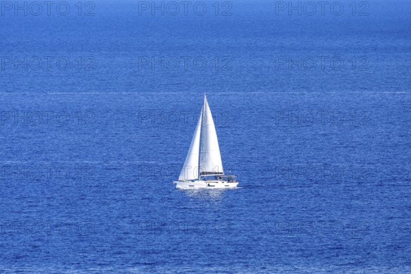 Sailing boat in the Mediterranean Aegean Sea vacation off the island of Rhodes, Greece