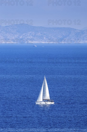 Sailing boat in the Mediterranean Aegean Sea vacation off the island of Rhodes, Greece