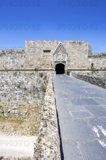 Red gate from the Middle Ages in the city wall of the historic old town on the island of Rhodes, Greece