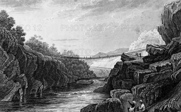 Rope bridge in Hindustan, India, rocky landscape, river, current, crossing, bridge of ropes, shaky, danger, architecture, steel engraving, historical illustration 1835