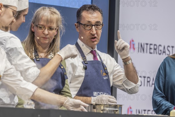 Cem is cooking! DEHOGA Baden-Württemberg event with candidate for the post of Minister-President, Cem Özdemir. The Green Party candidate is assisted by Beate Gaiser from the Hotel Adler in Freudenstadt, chairwoman of the DEHOGA Freudenstadt district association. INTERGASTRA, leading trade fair for the hotel and catering industry. Stuttgart, Baden-Württemberg, Germany