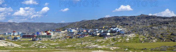 Typical architecture of Greenland Ilulissat with colored houses located near fjords and icebergs