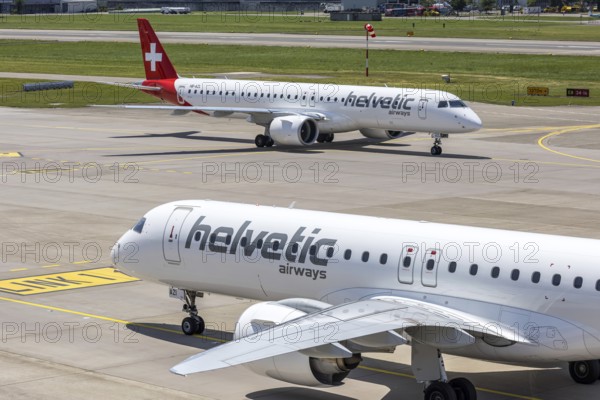 Embraer 195 E2 Helvetic Airways aircraft with the HB-AZI license plate at Zurich Airport, Switzerland