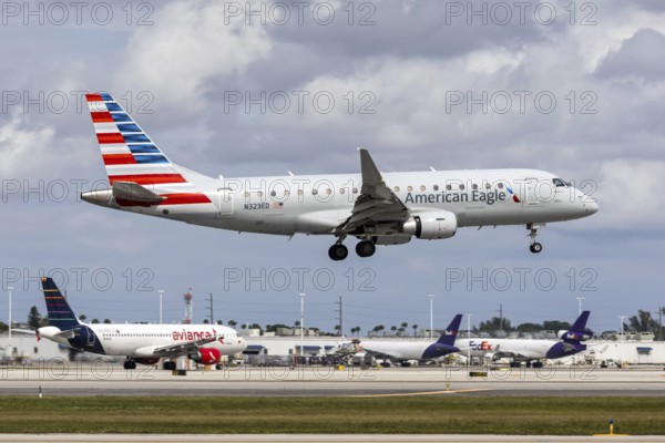 An American Eagle Envoy Air Embraer 175 aircraft with license plate N323ED at Miami airport, USA