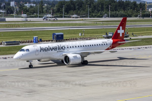 An Embraer 190 E2 Helvetic Airways aircraft with the HB-AZA license plate at Zurich Airport, Switzerland