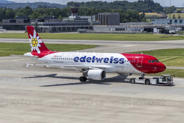 An Edelweiss Airbus A320 aircraft with the HB-JJK license plate at Zurich Airport, Switzerland