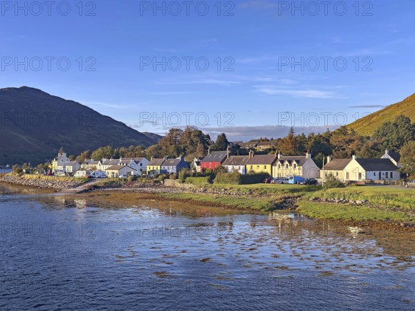 Small coastal village with views of the sea and surrounding mountains, Dornie, Eilean Donan Castle, Scotland, Great Britain