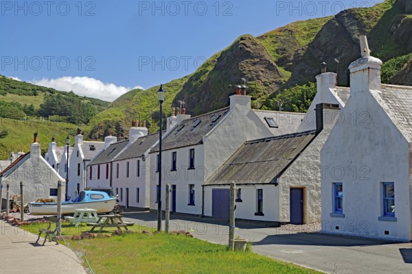 White houses at the foot of hills in a picturesque village, Local Hero, Pennan, Aberdeenshire, Scotland, United Kingdom
