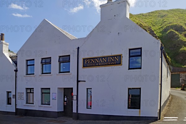 White inn in front of green hills under blue sky, hotel, film location, Local Hero, Pennan, Aberdeenshire, Scotland, Great Britain