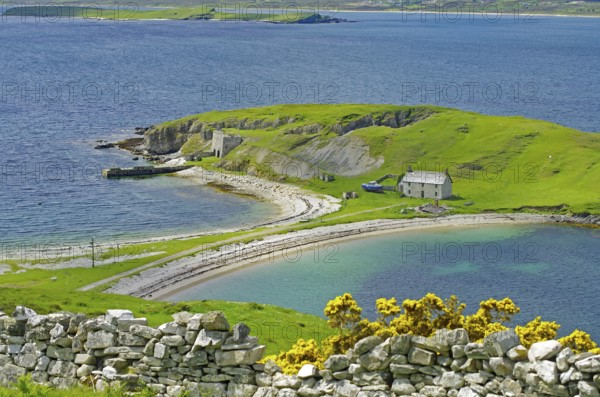 Tranquility by the sea with green landscape, stone house and gentle waves, Tongue, Highlands, West Coast, Scotland, United Kingdom
