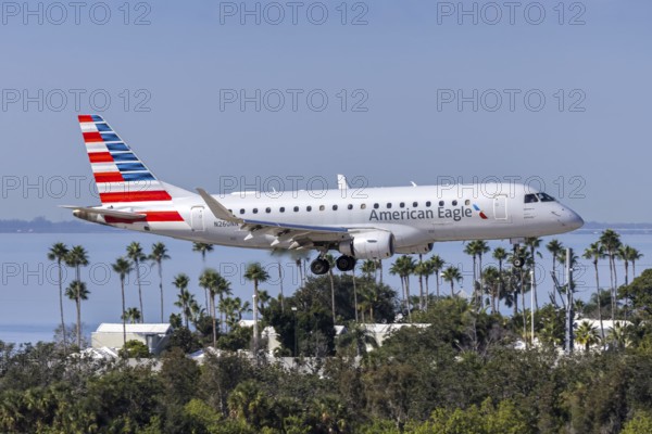 An American Eagle Embraer 175 aircraft with license plate N260NN at Tampa airport, USA