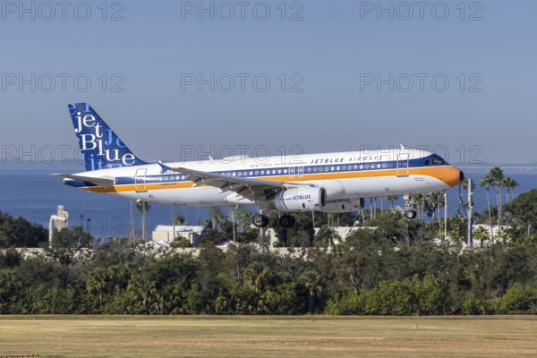 An Airbus A320 JetBlue Airways aircraft with the license plate N763JB and the What's Old is Blue Again retro special livery at Tampa Airport, USA