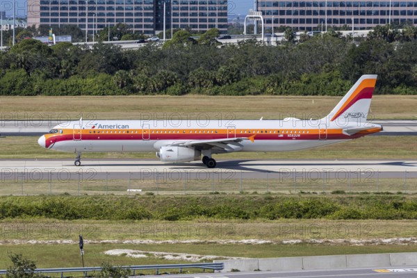 An American Airlines Airbus A321 aircraft with the license plate N582UW and the PSA Airlines retro special livery at Tampa airport, USA